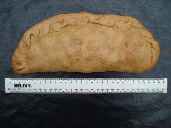 A third pasty with "afters" with a ruler to show the scale, not too small
